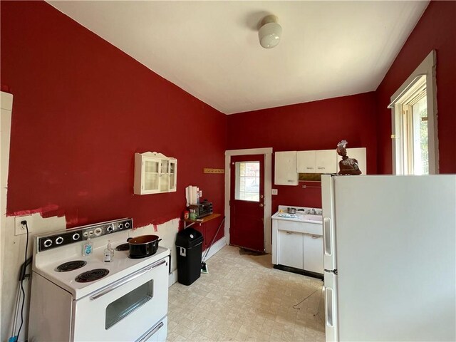 303 6th St, Charleston, IL 61920 - kitchen with white appliances and white cabinets