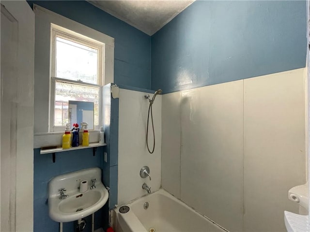 303 6th St, Charleston, IL 61920 - bathroom featuring sink and washtub / shower combination