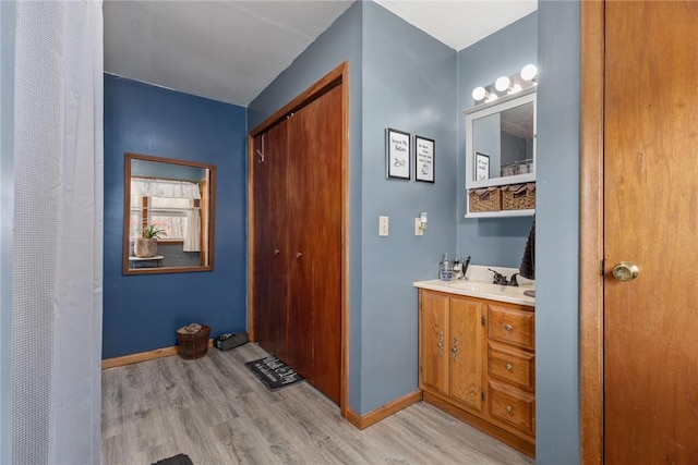 bathroom featuring vanity and hardwood / wood-style flooring