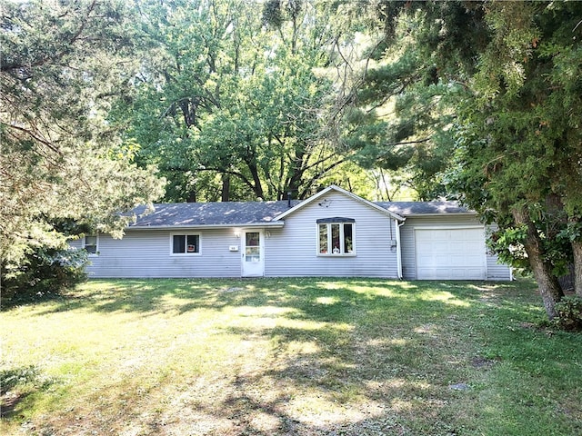 view of front of property with a garage and a front yard