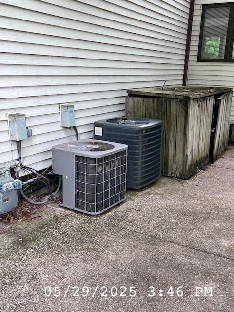 6680 John Dr, Mt Zion, IL 62549 - exterior view of a cooling unit