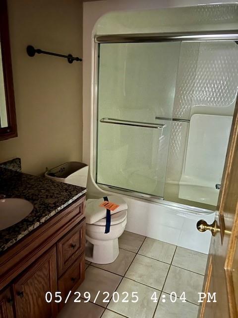 6680 John Dr, Mt Zion, IL 62549 - full bathroom featuring vanity, enclosed tub / shower combo, and tile patterned floors