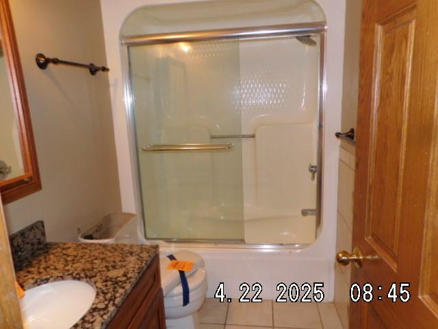 6680 John Dr, Mt Zion, IL 62549 - bathroom featuring vanity, bath / shower combo with glass door, and tile patterned floors