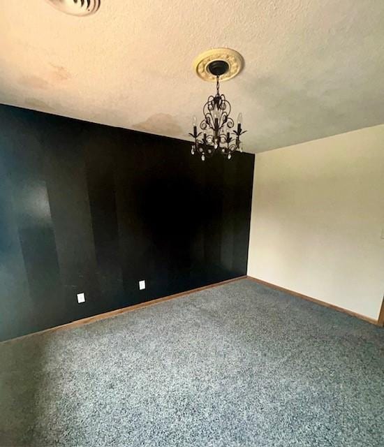 6680 John Dr, Mt Zion, IL 62549 - carpeted empty room featuring a chandelier and baseboards