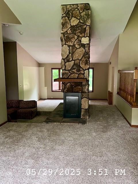6680 John Dr, Mt Zion, IL 62549 - carpeted living room featuring lofted ceiling and a fireplace