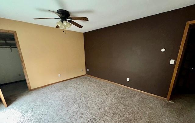 6680 John Dr, Mt Zion, IL 62549 - unfurnished bedroom featuring carpet, a closet, and ceiling fan