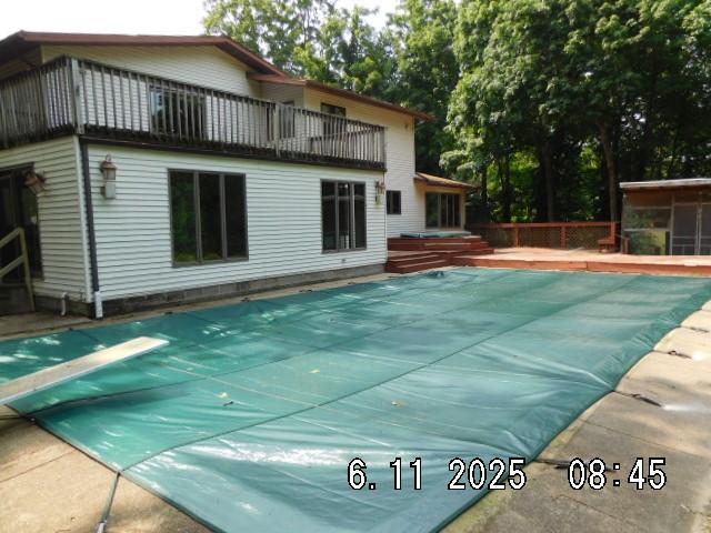 6680 John Dr, Mt Zion, IL 62549 - view of swimming pool featuring a diving board, a hot tub, and a patio
