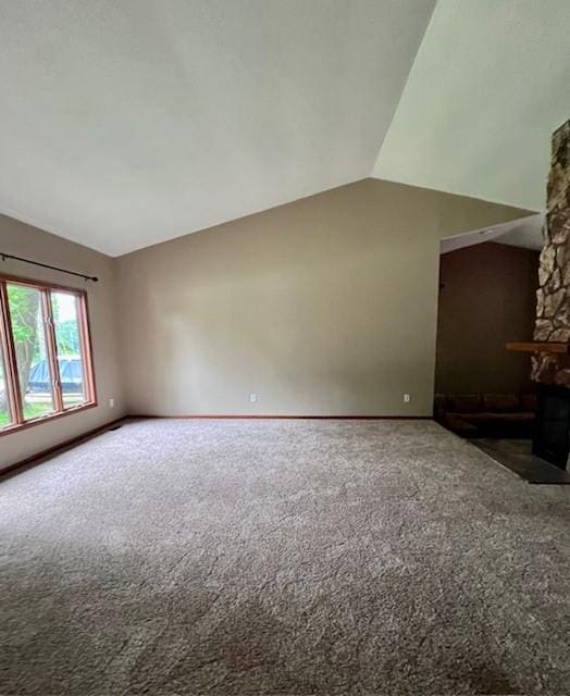 6680 John Dr, Mt Zion, IL 62549 - unfurnished living room with lofted ceiling, carpet flooring, and a fireplace