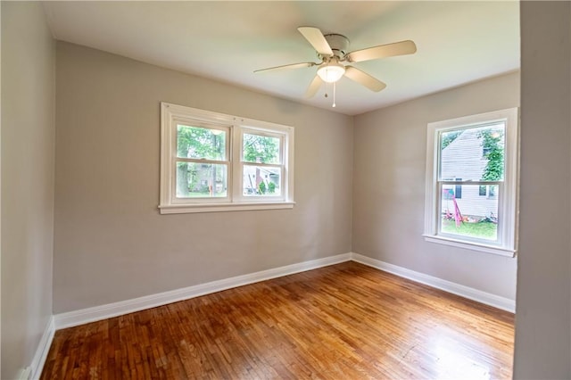 2036 E Dickinson Ave, Decatur, IL 62521 - unfurnished room with plenty of natural light, wood finished floors, and ceiling fan