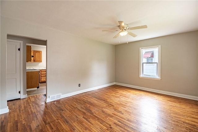 2036 E Dickinson Ave, Decatur, IL 62521 - spare room featuring a ceiling fan and wood finished floors