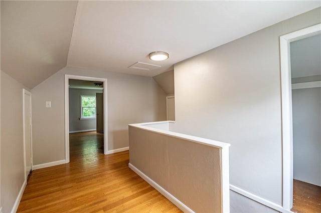 2036 E Dickinson Ave, Decatur, IL 62521 - hallway featuring light wood-style floors, an upstairs landing, and vaulted ceiling