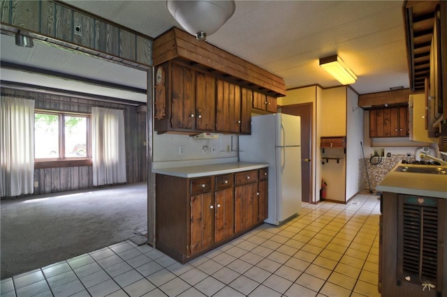 707 S Airport Rd, Decatur, IL 62521 - kitchen featuring freestanding refrigerator, light countertops, light tile patterned floors, and light carpet