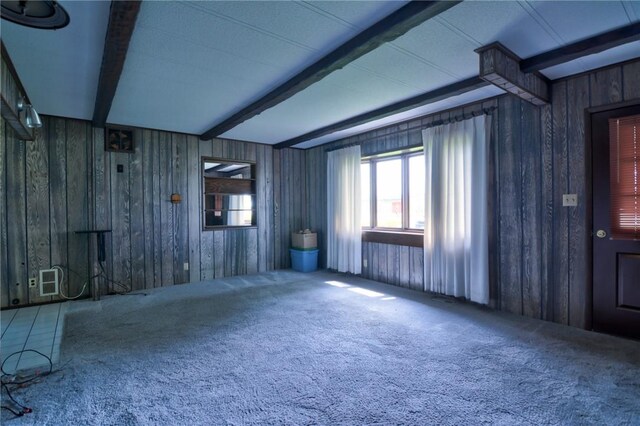 707 S Airport Rd, Decatur, IL 62521 - carpeted empty room with beam ceiling and wooden walls