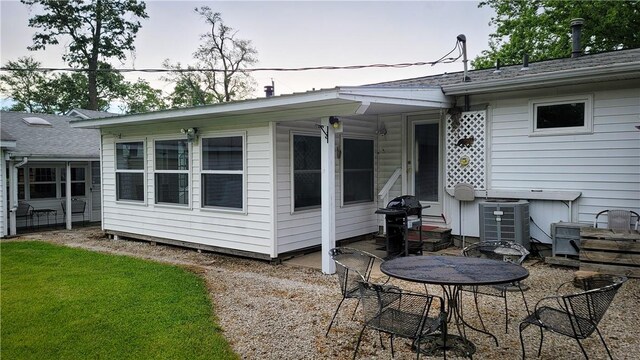 707 S Airport Rd, Decatur, IL 62521 - rear view of property with a patio and a yard