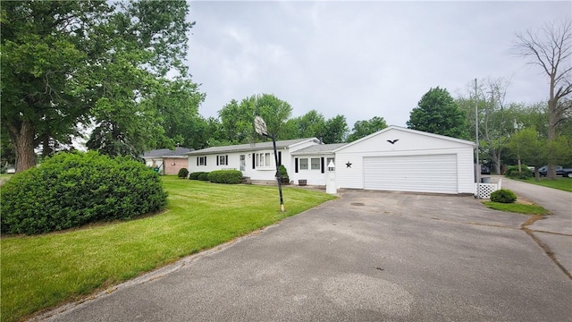 707 S Airport Rd, Decatur, IL 62521 - single story home with driveway, a garage, and a front lawn