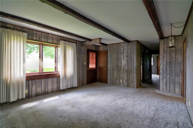 707 S Airport Rd, Decatur, IL 62521 - carpeted spare room with beamed ceiling and wooden walls