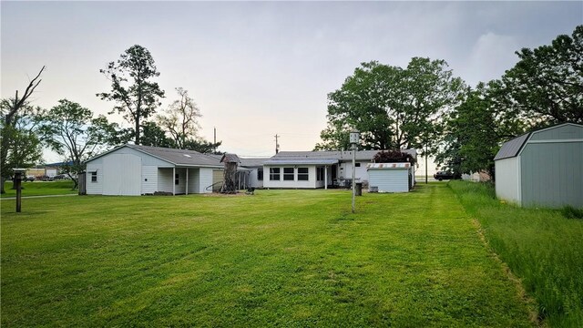 707 S Airport Rd, Decatur, IL 62521 - back of property with a yard and a shed
