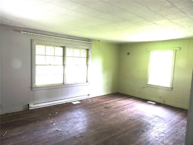 305 Porter St, Danville, IL 61832 - unfurnished room with baseboard heating and hardwood / wood-style flooring
