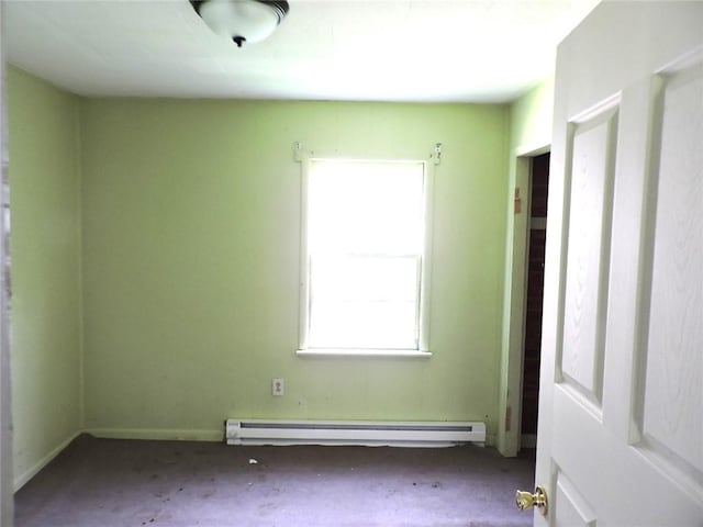 305 Porter St, Danville, IL 61832 - carpeted spare room featuring a baseboard radiator