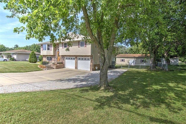 935 Woodland Dr, Mt Zion, IL 62549 - raised ranch with driveway, an attached garage, and brick siding