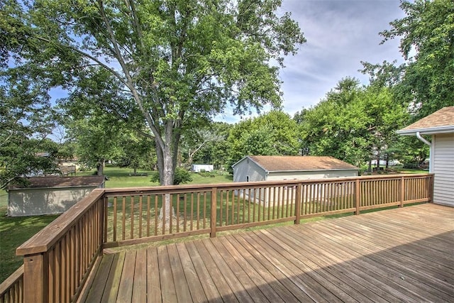 935 Woodland Dr, Mt Zion, IL 62549 - deck featuring a lawn and an outdoor structure