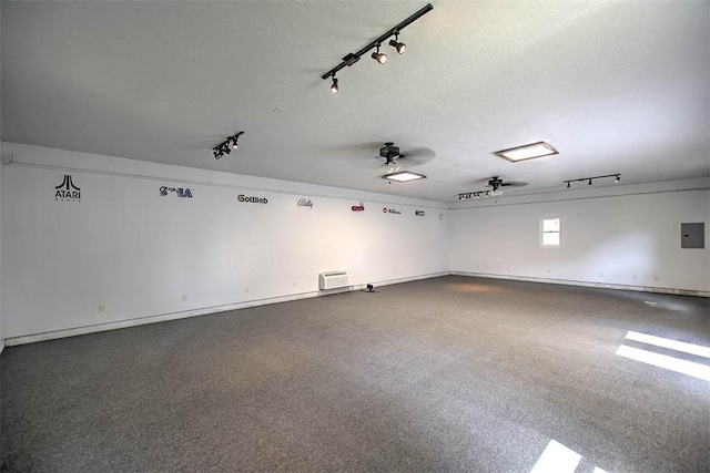 935 Woodland Dr, Mt Zion, IL 62549 - spare room with rail lighting, a ceiling fan, and electric panel