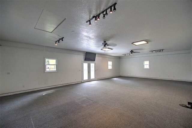 935 Woodland Dr, Mt Zion, IL 62549 - garage featuring french doors and a ceiling fan