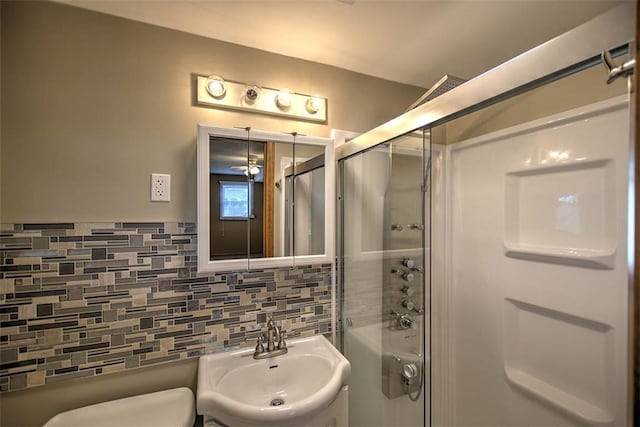 935 Woodland Dr, Mt Zion, IL 62549 - bathroom with a shower with shower door and tasteful backsplash