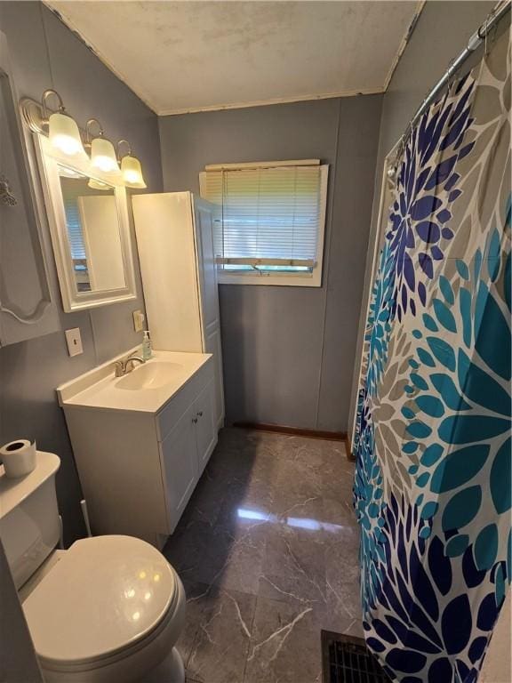 708 E Washington St, Clinton, IL 61727 - bathroom with marble finish floors, vanity, a shower with shower curtain, and ornamental molding