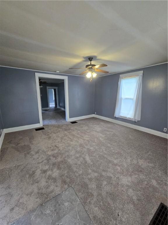 708 E Washington St, Clinton, IL 61727 - empty room with a ceiling fan and carpet