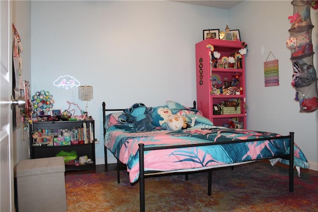 bedroom featuring baseboards