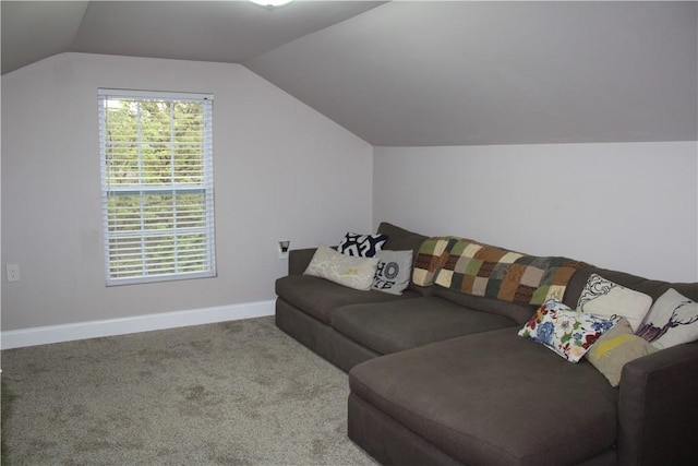 living area with vaulted ceiling, baseboards, and carpet floors