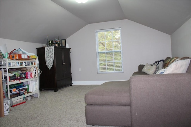 sitting room with carpet floors and lofted ceiling