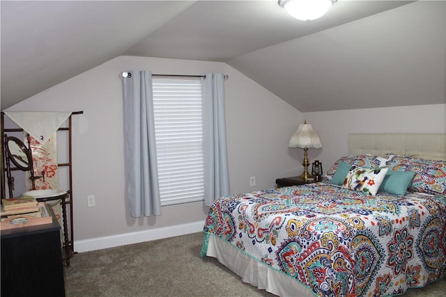 bedroom with carpet flooring, vaulted ceiling, and baseboards