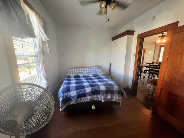 bedroom with hardwood / wood-style flooring and ceiling fan