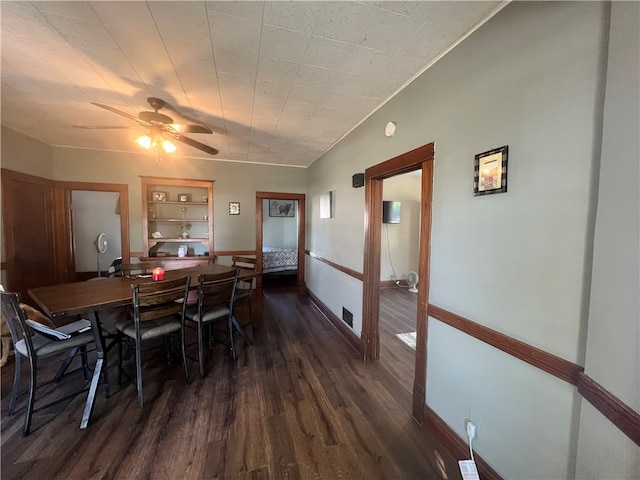 dining room featuring built in shelves, dark hardwood / wood-style flooring, and ceiling fan