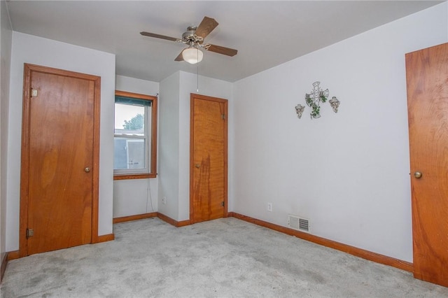 820 Oklahoma Ave, Mattoon, IL 61938 - unfurnished bedroom with carpet floors and ceiling fan