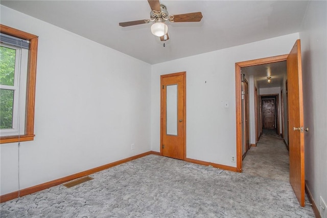 820 Oklahoma Ave, Mattoon, IL 61938 - unfurnished room with carpet and a ceiling fan