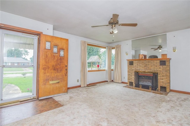 820 Oklahoma Ave, Mattoon, IL 61938 - unfurnished living room with a ceiling fan, a brick fireplace, and carpet flooring
