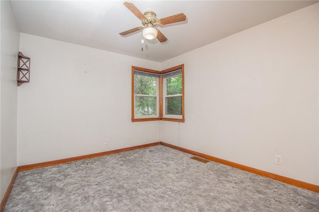820 Oklahoma Ave, Mattoon, IL 61938 - carpeted empty room featuring baseboards and ceiling fan