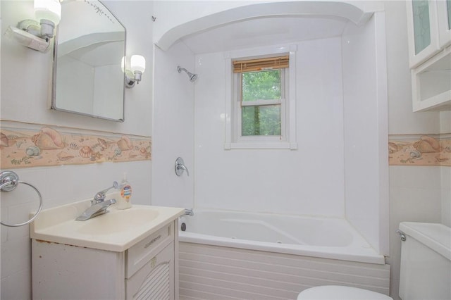 820 Oklahoma Ave, Mattoon, IL 61938 - full bath featuring tile walls, shower / washtub combination, vanity, and wainscoting