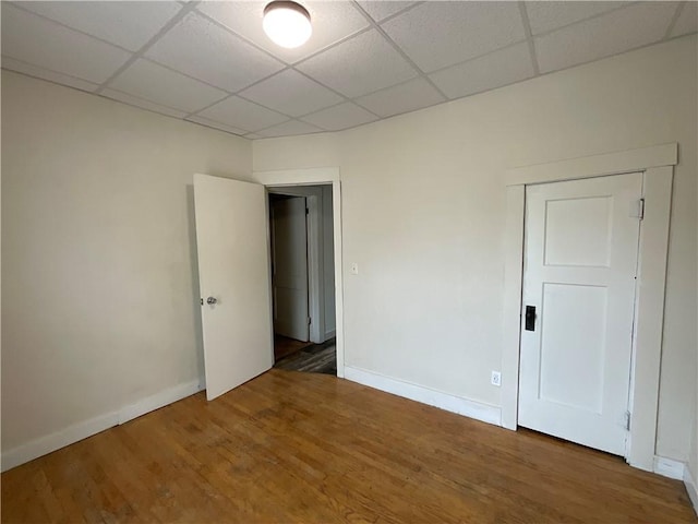 601 S Maple St, Effingham, IL 62401 - empty room with a paneled ceiling, baseboards, and wood finished floors