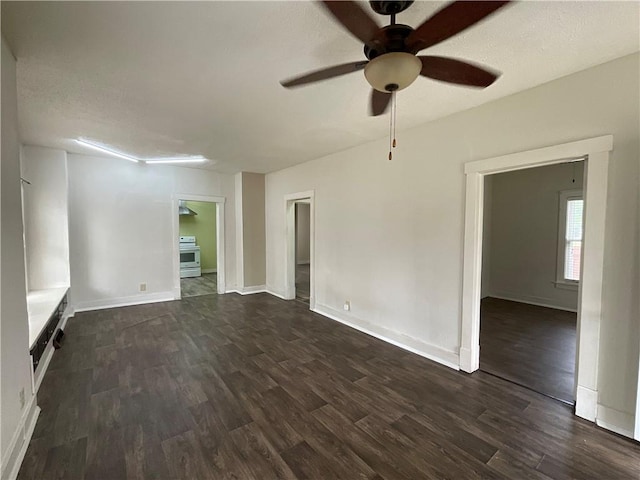 601 S Maple St, Effingham, IL 62401 - unfurnished room featuring dark wood-style flooring, ceiling fan, and baseboards