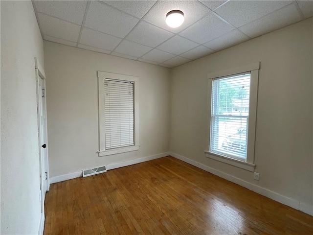 601 S Maple St, Effingham, IL 62401 - spare room with a drop ceiling, wood finished floors, and baseboards