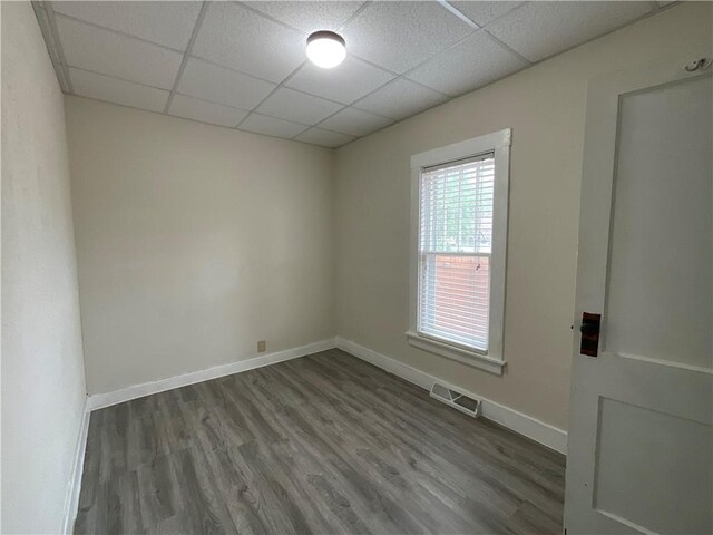 601 S Maple St, Effingham, IL 62401 - unfurnished room featuring a drop ceiling, wood finished floors, and baseboards