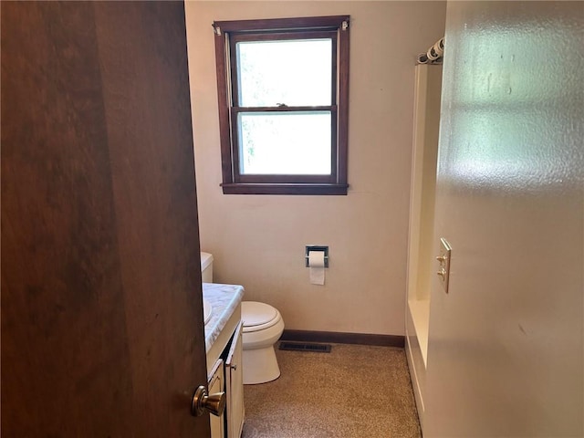 300 W Alabama Ave, Casey, IL 62420 - bathroom featuring toilet, vanity, and baseboards