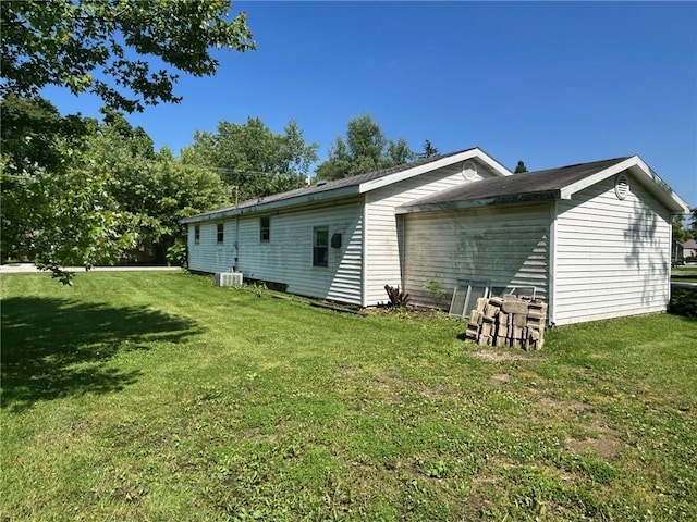 300 W Alabama Ave, Casey, IL 62420 - view of side of home with a yard and central AC