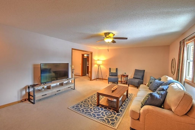 993 Cedar Hill Dr, Decatur, IL 62521 - carpeted living area featuring ceiling fan, baseboards, and a textured ceiling