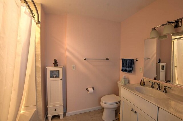 993 Cedar Hill Dr, Decatur, IL 62521 - bathroom featuring tile patterned flooring, toilet, vanity, and baseboards