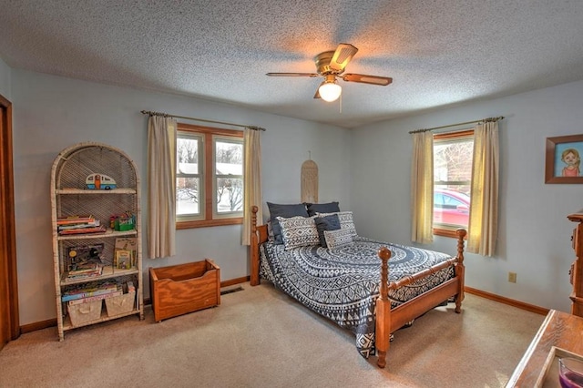 993 Cedar Hill Dr, Decatur, IL 62521 - bedroom with carpet, a textured ceiling, baseboards, and ceiling fan
